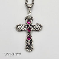 Ruby (Lab Created) Wire Wrapped Cross Pendant in Sterling Silver (Oxidized) Material: Sterling Silver (Oxidized) Stones: Ruby (Lab Created) Pendant height: 36mm Pendant width: 23mm Chain: Stainless Steel Round Rolo Chain (3mm) ~ Choose Length 18"-30" Inches