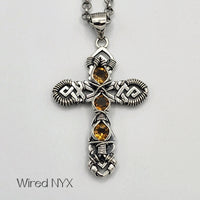 Natural Citrine Wire Wrapped Cross Pendant in Sterling Silver (Oxidized) Material: Sterling Silver (Oxidized) Stones: Natural Citrine Pendant height: 36mm Pendant width: 23mm Chain: Stainless Steel Round Rolo Chain (3mm) ~ Choose Length 18"-30" Inches