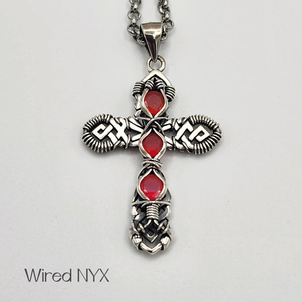 Pink Opal Gemstone Wire Wrapped Cross Pendant in Sterling Silver (Oxidized) Material: Sterling Silver (Oxidized) Stones: Pink Opal Pendant height: 36mm Pendant width: 23mm Chain: Stainless Steel Round Rolo Chain (3mm) ~ Choose Length 18"-30" Inches